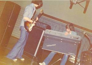 Danny Imig, age 14, with his very first guitar, a Univox High Flyer, in the band EFFIGY, playing a Beecher High School dance, 1974. Rocking the Farfisa keyboard bandmate John Knuth. Photo by Al Stanbro.
