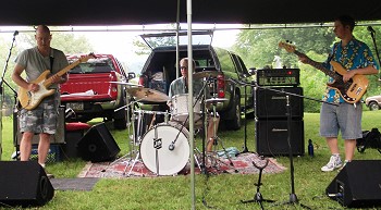 ROCK, PAPER, SCISSORS (left to right, Danny, Jim Sturdevant, Doug Hoffman) crank out surf, spy, psychedelic blues, and originals at Andy's, Warren, PA, May 2010.